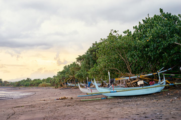 Naklejka na ściany i meble Beautiful landscape. Ocean, beach and indonesian fishing boats.