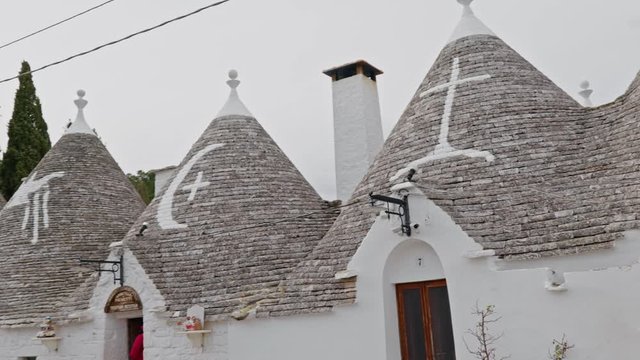 Walking streets of trulli town Alberobello, Italy