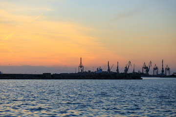 port at sea at sunset