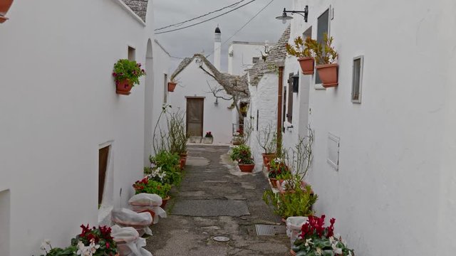 Walking streets of trulli town Alberobello, Italy