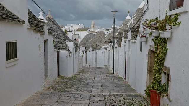 Walking streets of trulli town Alberobello, Italy