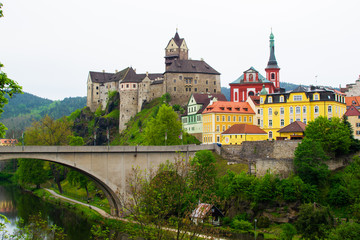 Fototapeta premium View of the bridge above Ohre river, the Castle and the Church of St. Wenceslaus in Loket, Czech Republic