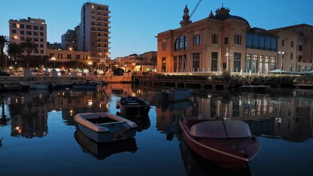 Old fishing boats in Bari at sunset, Italy