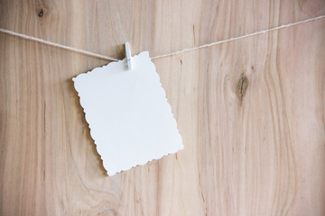 white sheet on clothespins hang on thread