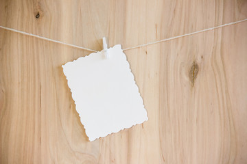 white sheet on clothespins hang on thread