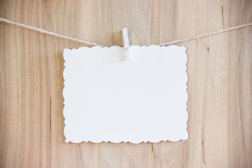 white sheet on clothespins hang on thread