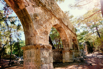 Naklejka premium Travel and architecture. Ancient aqueduct in antique town Phaselis, Turkey.
