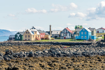 Colorful buildings and the charming city of Flatey Island in Iceland just outside Stykkisholmur and...