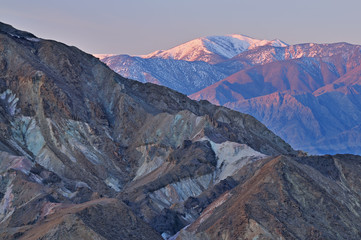 Fototapeta na wymiar Landscape at sunrise, Golden Canyon and Panamint Mountains from Zabriskie Overlook, Death Valley National Park, California, USA