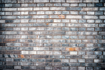 Grey brick wall textured background.