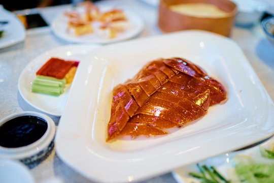 Peking Duck - Chinese Roast Crispy Duck Served With Hoisin Sauce, Pancakes, Cucumber And Spring Onions.
