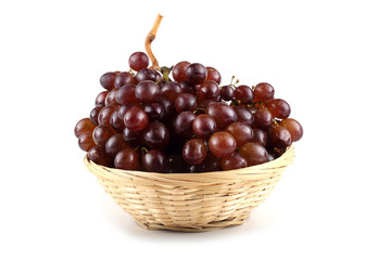 Black grape on wicker plate