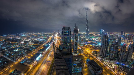 Fototapeta na wymiar Beautiful panoramic skyline of Dubai night timelapse, United Arab Emirates. View of world famous skyscrapers.