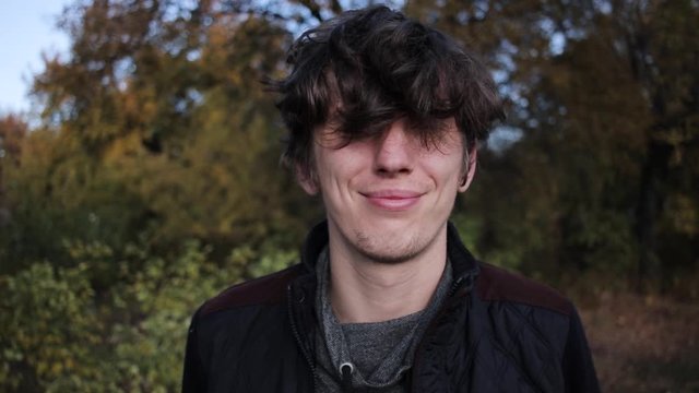 smug attractive young man smiling