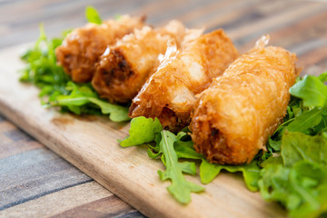 pork spring rolls Rice cakes stuffed with a pork stuffing accompanied by sauce