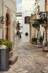 Obraz premium Walking charming white streets of Locorotondo in Puglia, Italy