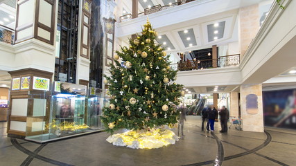 Multilevel shopping mall interior decorated with christmas tree timelapse hyperlapse