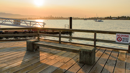 Fototapeta premium Sunrise over the a landing bridge and the skyline of Vancouver, North-America, Canada, British Colombia, August 2015