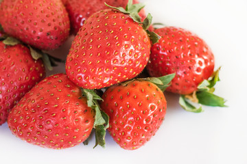 Large ripe strawberries on a white background