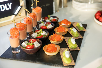 Tartlets with salmon red caviar and feta cheese. Sandwich for lunch.