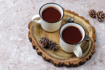 Two cup of hot chocolate with marshmallow on light background