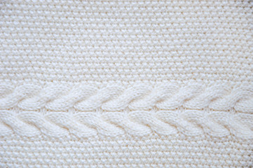 White knitted texture. Knitting braids. Beautiful background.