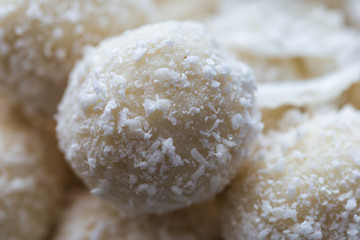 Raw coconut balls close up. Vegan food.
