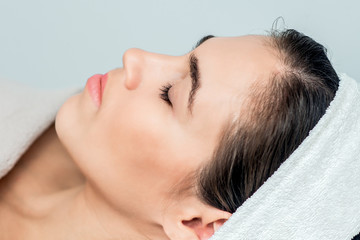Fototapeta na wymiar Face of woman with closed eyes ready for skin care and procedures.