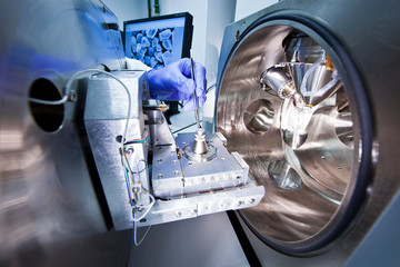 A scientist using scanning electronic microscope