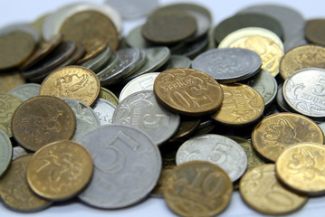 a handful of coins in different denominations rubles close up