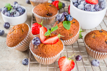 Vanilla muffins or cupcakes with berries