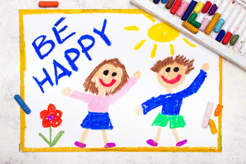 Photo of colorful drawing: Smiling boy and girl and phrase BE HAPPY. Positive thinking concept