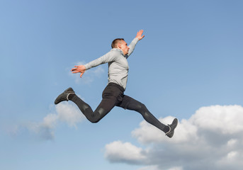 Fototapeta na wymiar Portrait of athletic man jumping