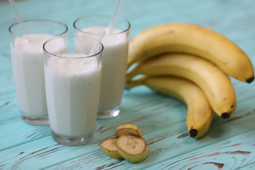 milk shake with babana on blue table