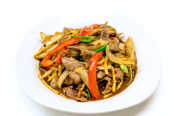 Stir-fried beef with bamboo shoots  in white plate on white background, Close up.