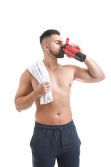 Naklejka premium Sporty man with protein shake on white background