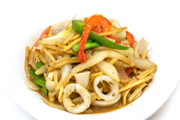 Stir-fried squid with bamboo shoots  in white plate on white background, Close up.