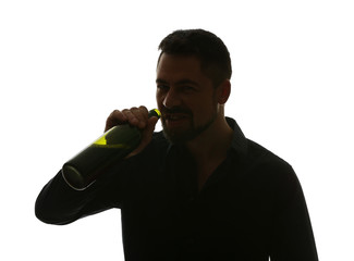 Silhouette of mature man drinking alcohol on white background