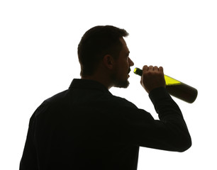 Silhouette of mature man drinking alcohol on white background