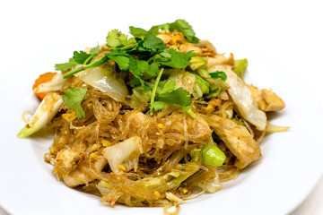 Pad woon sen is a particularly delicious Thai noodle dish. Woon sen are thin glass noodles made of rice or bean.They're typically stir-fried with meat, vegetables, sauces and egg. © Chansak Joe A.