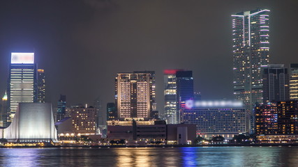 Naklejka premium Hong Kong Cultural Centre with colorful light projection on its wall timelapse hyperlapse.