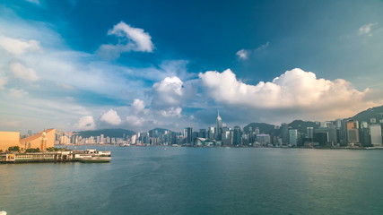 Hong Kong Harbor panorama cityscape timelapse - Central District, Victoria Harbor, Victoria Peak, Hong Kong Island and Kowloon, Hong Kong.