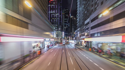 Fototapeta na wymiar View from double-decker tram on street of HK timelapse hyperlapse.