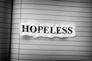 Crumpled piece of paper with the word Hopeless