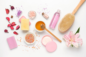 Composition with spa items and honey on white background