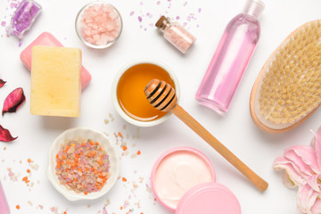 Composition with spa items and honey on white background