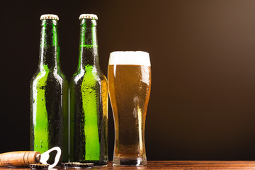 Close-up beer bottles with a glass