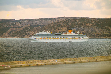 Modern Italian cruiseship cruise ship liner Fascinosa during sunset sail away departure from port...