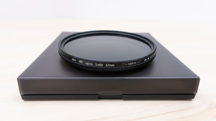 ND filter with case on bright background