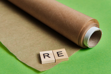 reduce, reuse and recycle word in vintage wooden letterpress type blocks, flatlay on green font